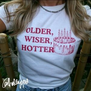 birthday “older wiser hotter” baby tee